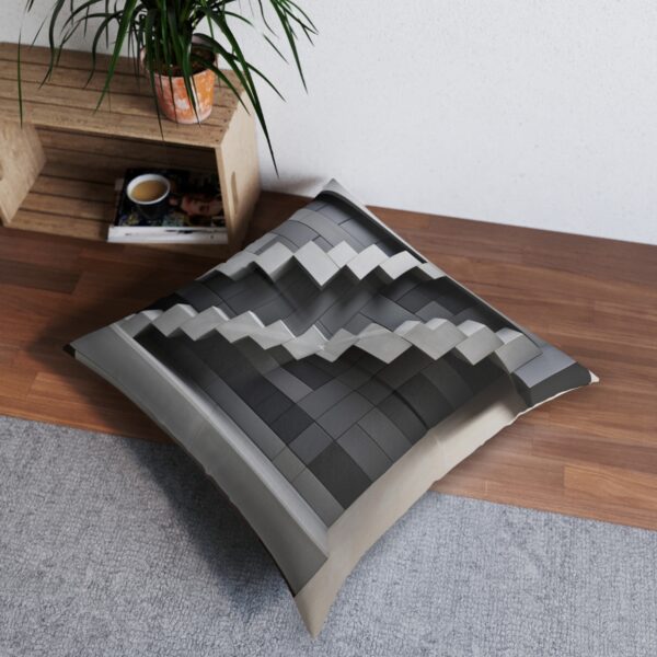 Artful gray rectangular block staircase illusion on tufted floor pillow