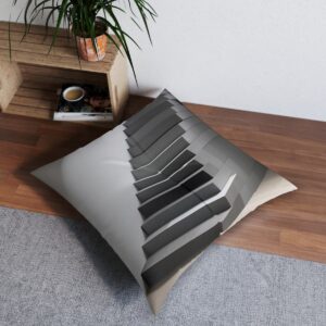 Gray staircase illusion tufted floor pillow on wood floor