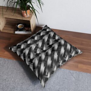 Tufted floor pillow with intricate monochrome parallelogram pattern