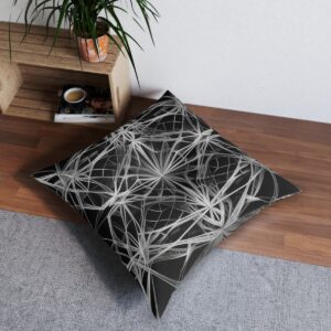 Monochrome tufted floor pillow with sophisticated geometric web design