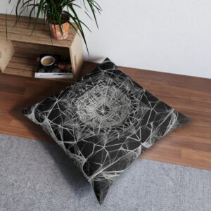 Tufted floor pillow with a complex web of geometric shapes in black and white