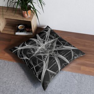 Tufted floor pillow with a web of thin precise geometric lines in black and white