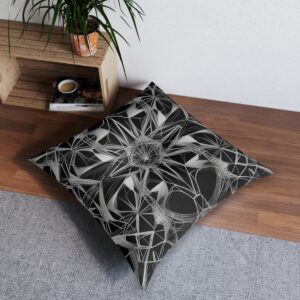 This tufted floor pillow features a sophisticated black and white design, where a complex web of geometric shapes is crafted with thin, precise lines, offering a stunning combination of modern style and comfort.