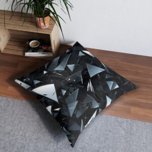 Tufted floor pillow with bold monochrome shattered glass pattern