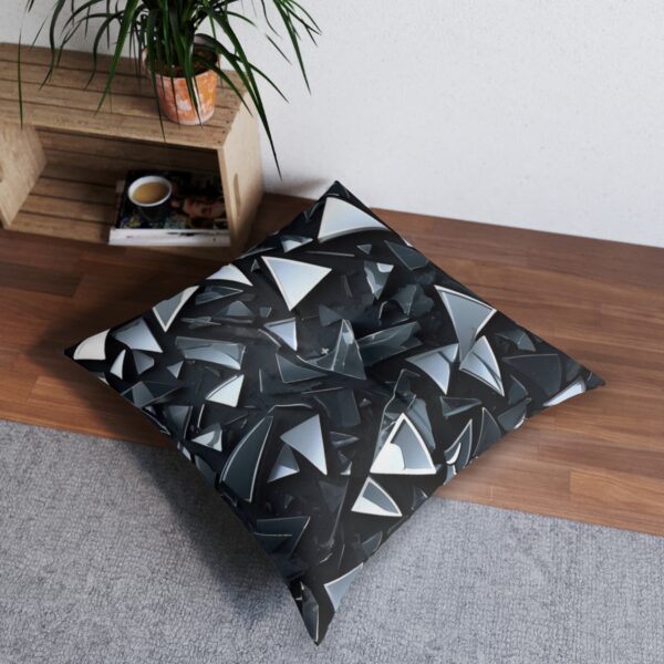 Sleek tufted floor pillow with striking shattered glass effect in monochrome