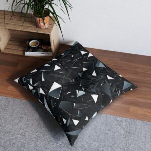 Chic tufted floor pillow with sharp monochrome angular shards pattern