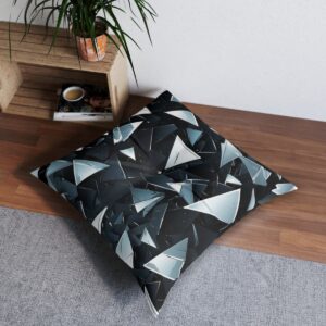 Contemporary tufted floor pillow with bold monochrome shattered glass design