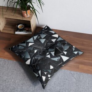 Modern tufted floor pillow with monochrome angular shards pattern in a stylish room