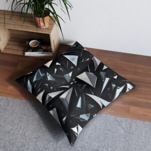 Black and white shattered glass pattern tufted floor pillow in a contemporary setting