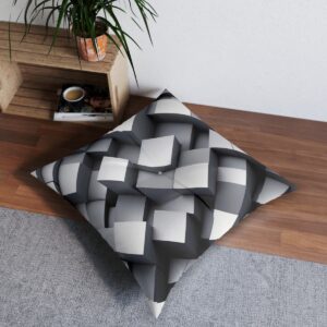 Geometric intrigue tufted floor pillow with contrasting gray three-dimensional cubes