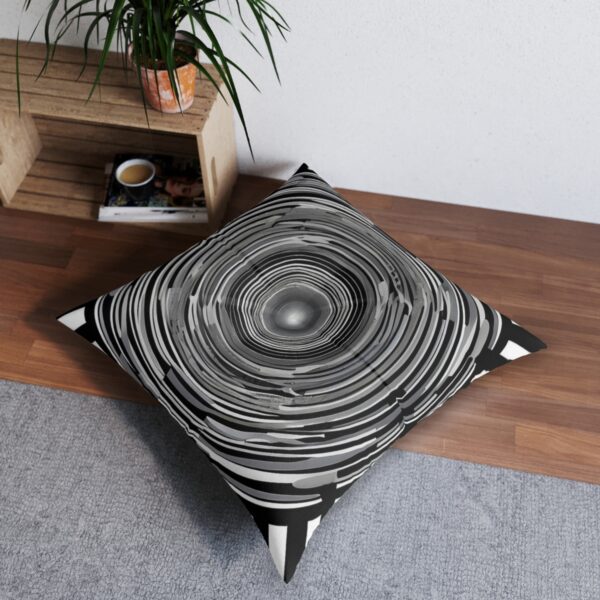 Illusionary rings tufted floor pillow with monochrome concentric circles