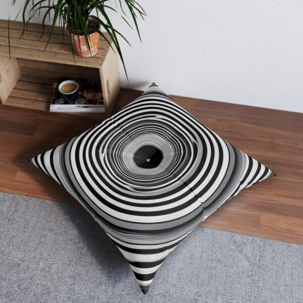 Monochrome vortex tufted floor pillow with captivating op-art design