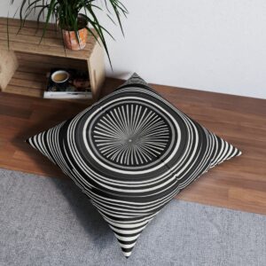 Spiral focus tufted floor pillow with monochrome op-art pattern