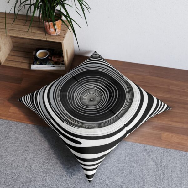 Optical vortex tufted floor pillow with monochrome concentric circles