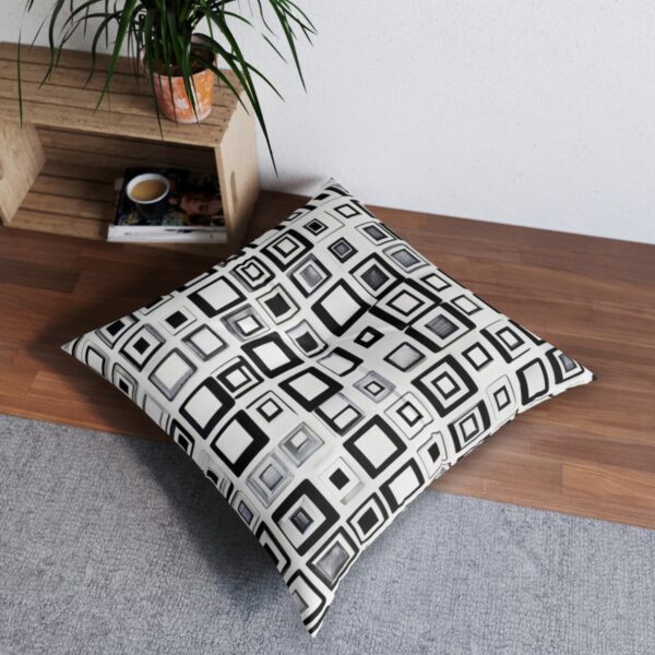 Geometric matrix tufted floor pillow with complex black square grid