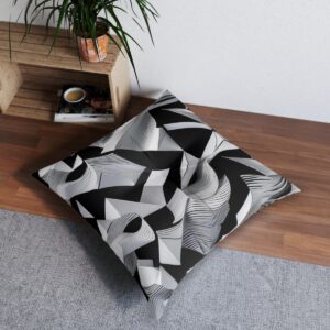 Graphic black and white tufted floor pillow with interlaced angular waves