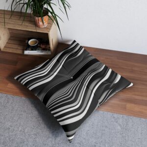 Black and white striped tufted floor pillow with wave design