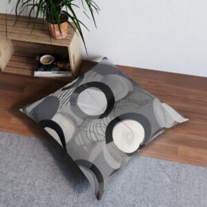 Contemporary tufted floor pillow with dimensional circles in gray shades