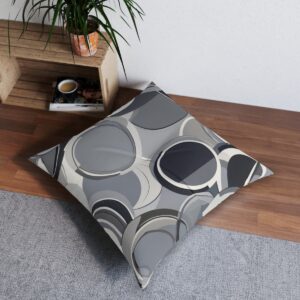 Modern gray tufted floor pillow with bold overlapping circles