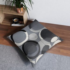 Monochromatic tufted floor pillow with overlapping circles design