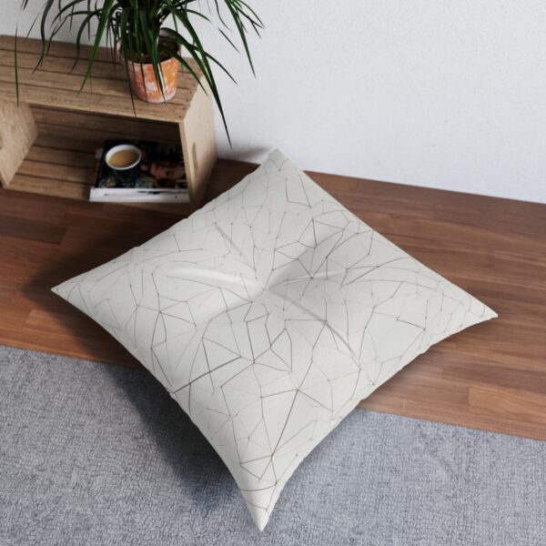 alternative: Modern white tufted floor pillow with geometric line design