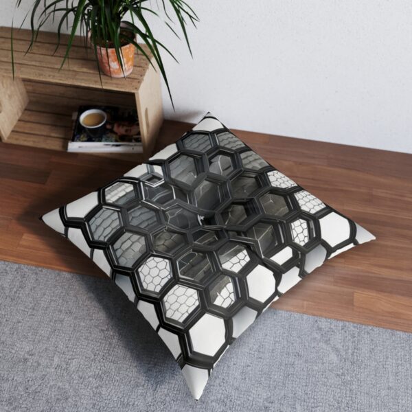 Tufted floor pillow with hexagonal pattern in grayscale