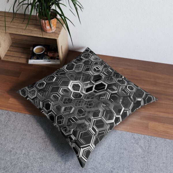 Tufted floor pillow with detailed monochrome hexagonal pattern