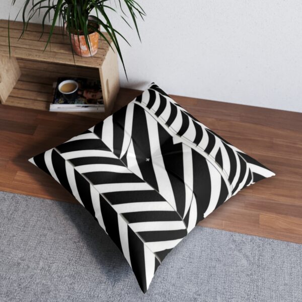 Tufted floor pillow with sharp black and white striped pattern