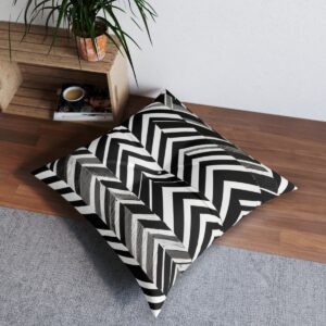 Tufted floor pillow with dynamic black and white chevron pattern