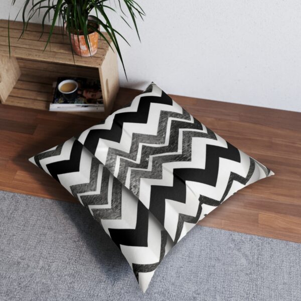 Tufted floor pillow with eye-catching black and white chevron design