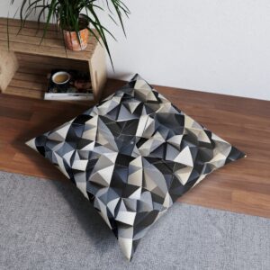 Tufted floor pillow with bold geometric print in interlocking triangles design