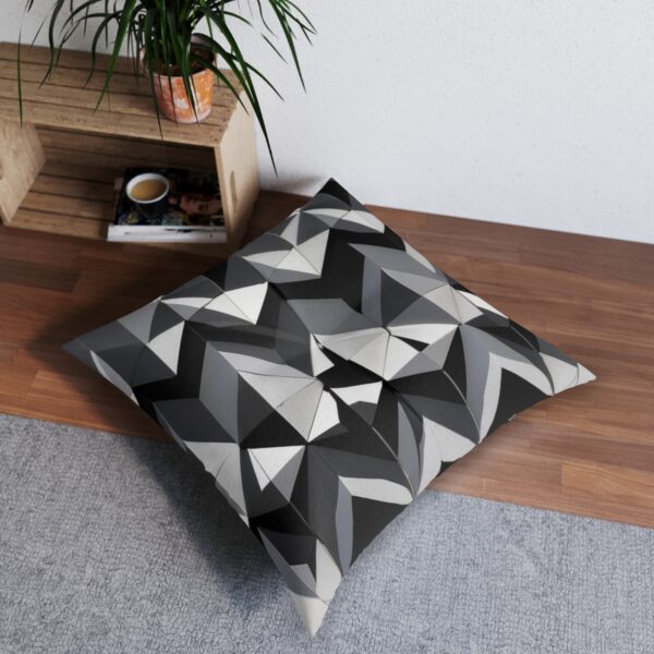 Contemporary tufted floor pillow with sleek interlocking triangles design