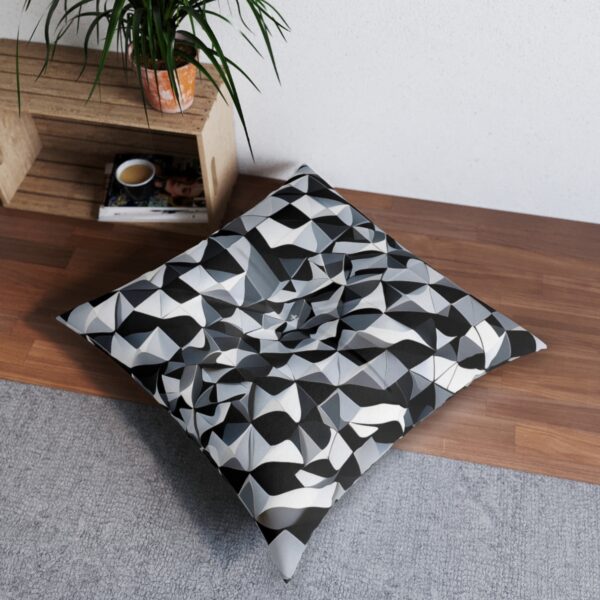 Stylish tufted floor pillow with bold interlocking triangles design