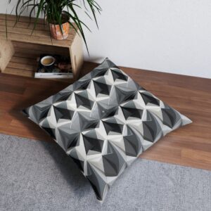 Modern geometric tufted floor pillow with interlocking triangles design