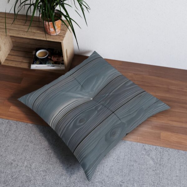 Silver Whisper tufted floor pillow with wood grain pattern on wooden floor