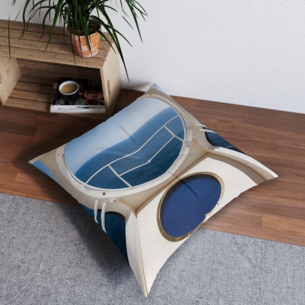 Ocean calm tufted floor pillow with sea perspective through portholes and navy stripes