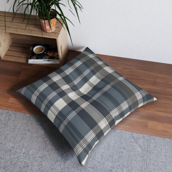 Plush tufted floor pillow with sophisticated plaid pattern in forest green and creamy beige