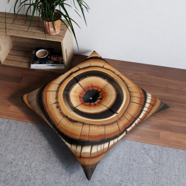 Eye-catching tree ring design tufted floor pillow in black gold and tan