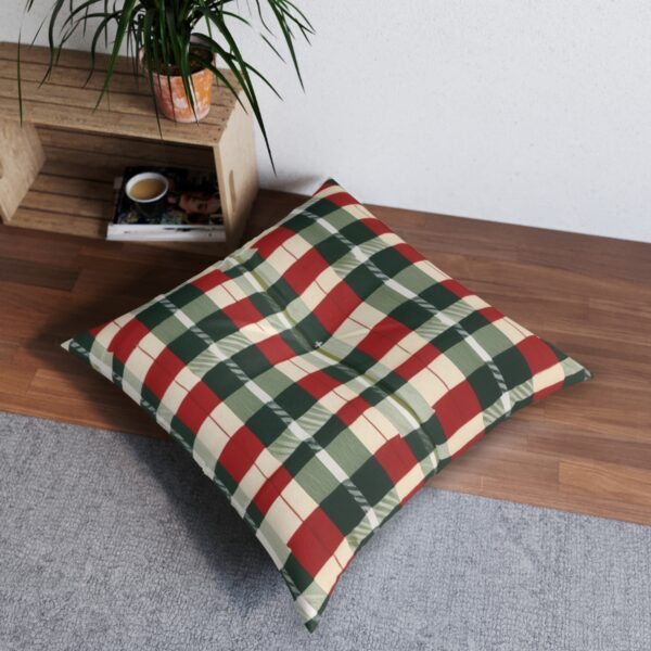 Cozy square tufted floor pillow with classic green and red plaid on beige background