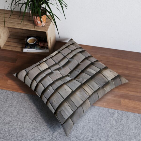 Tufted floor pillow with shingle-like design in a mountain lodge style room