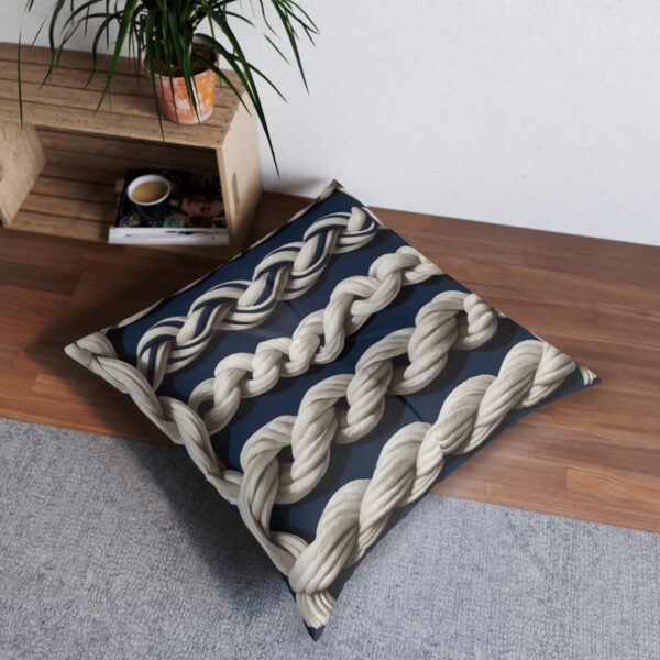 Timeless nautical tufted floor pillow with sailor's knots on navy stripes