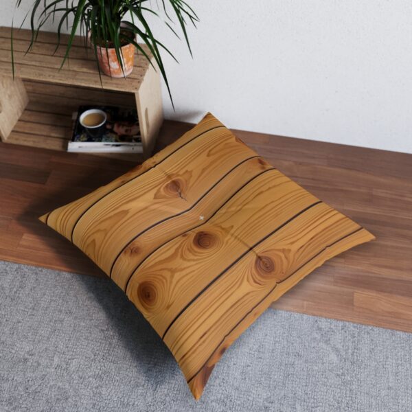 Knotty pine textured tufted floor pillow in honey amber hue