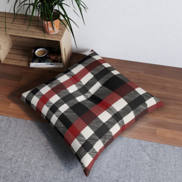 Black and red buffalo check plaid tufted floor pillow on wooden floor