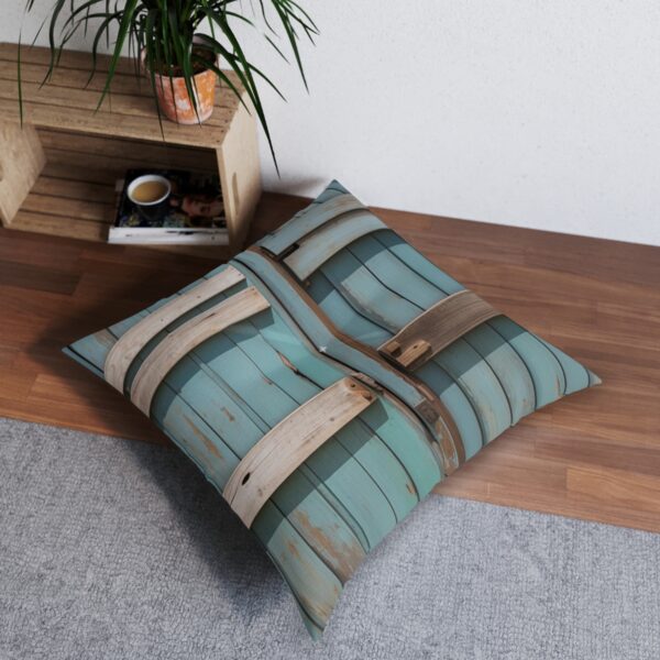 Weathered farmhouse door design tufted floor pillow in room