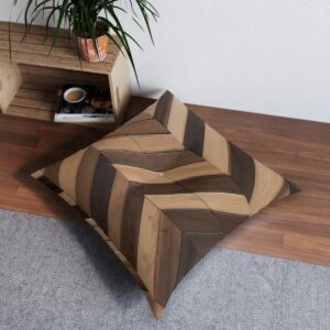 Square tufted floor pillow with bold herringbone wood pattern