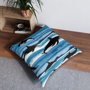 Whale and dolphin silhouettes on striped navy and sky blue tufted floor pillow