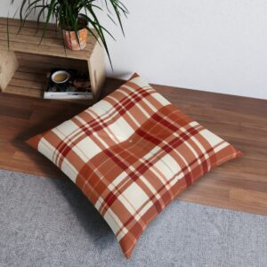 Square tufted floor pillow with terra cotta and cream plaid pattern