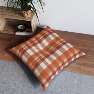 Square tufted floor pillow with warm fall-inspired orange and white plaid