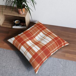 Tufted floor pillow with autumnal orange and barn red flannel-inspired plaid