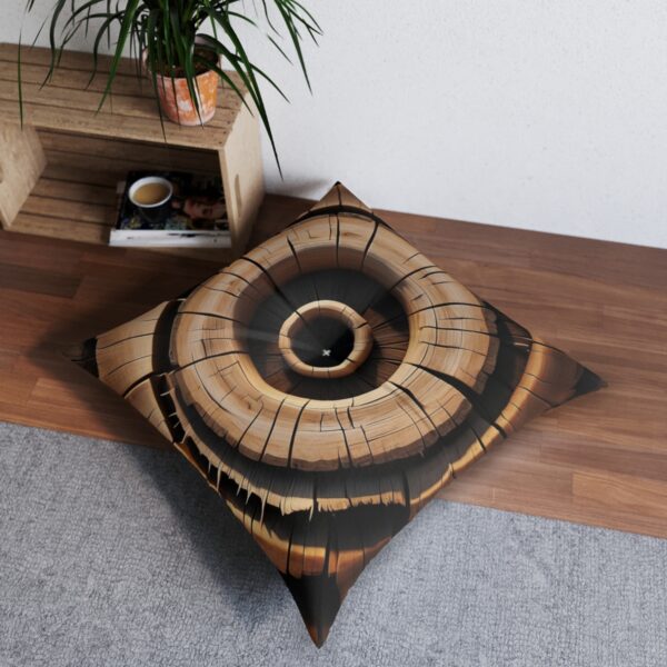 Square tufted floor pillow with striking tree ring pattern